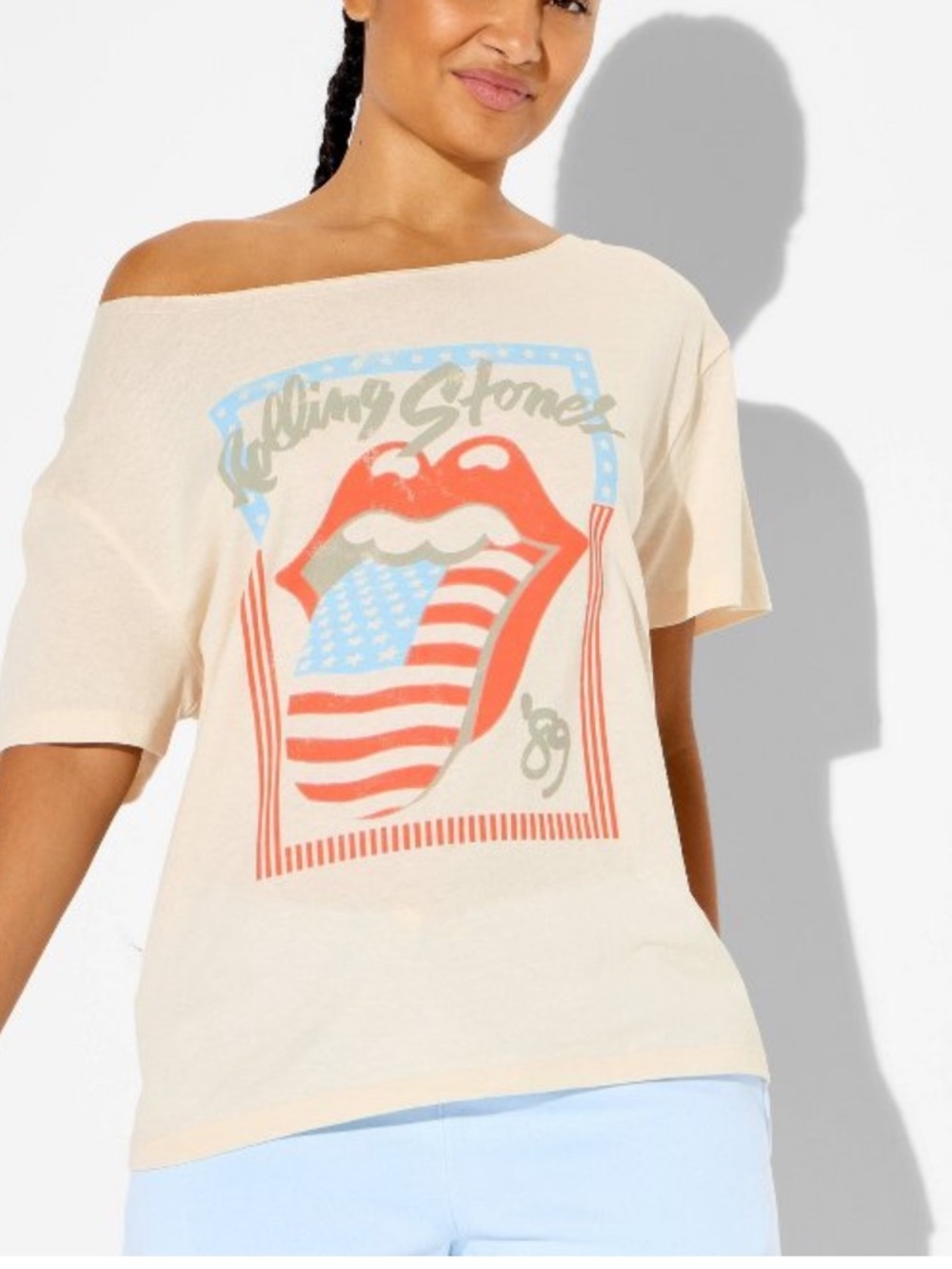 the Rolling Stones Cream Off-Shoulder Tee with Red & Blue Graphic